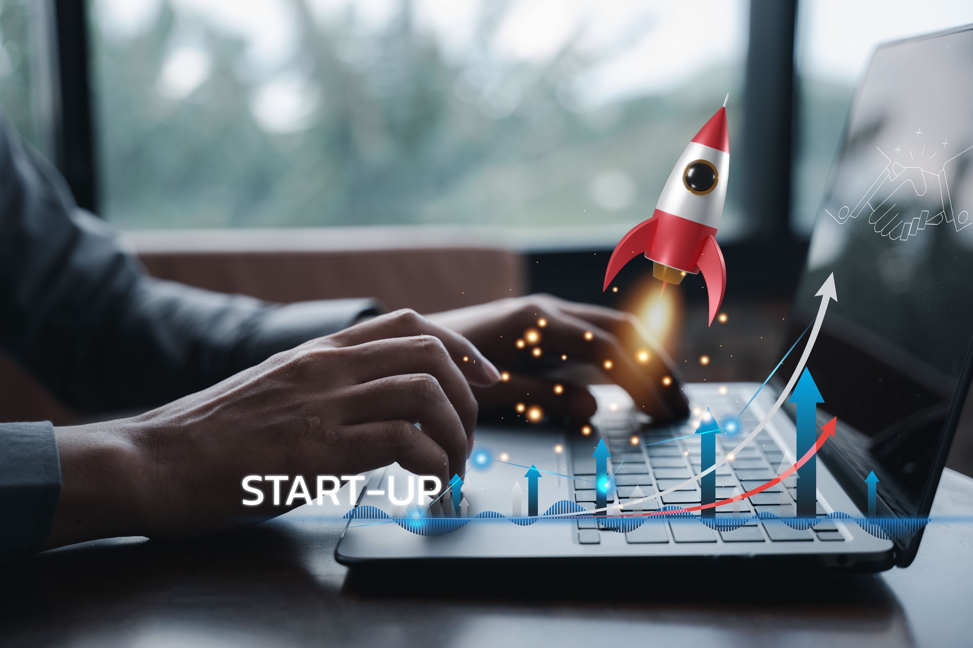 Business startup concept with a rocket icon launching from a laptop
